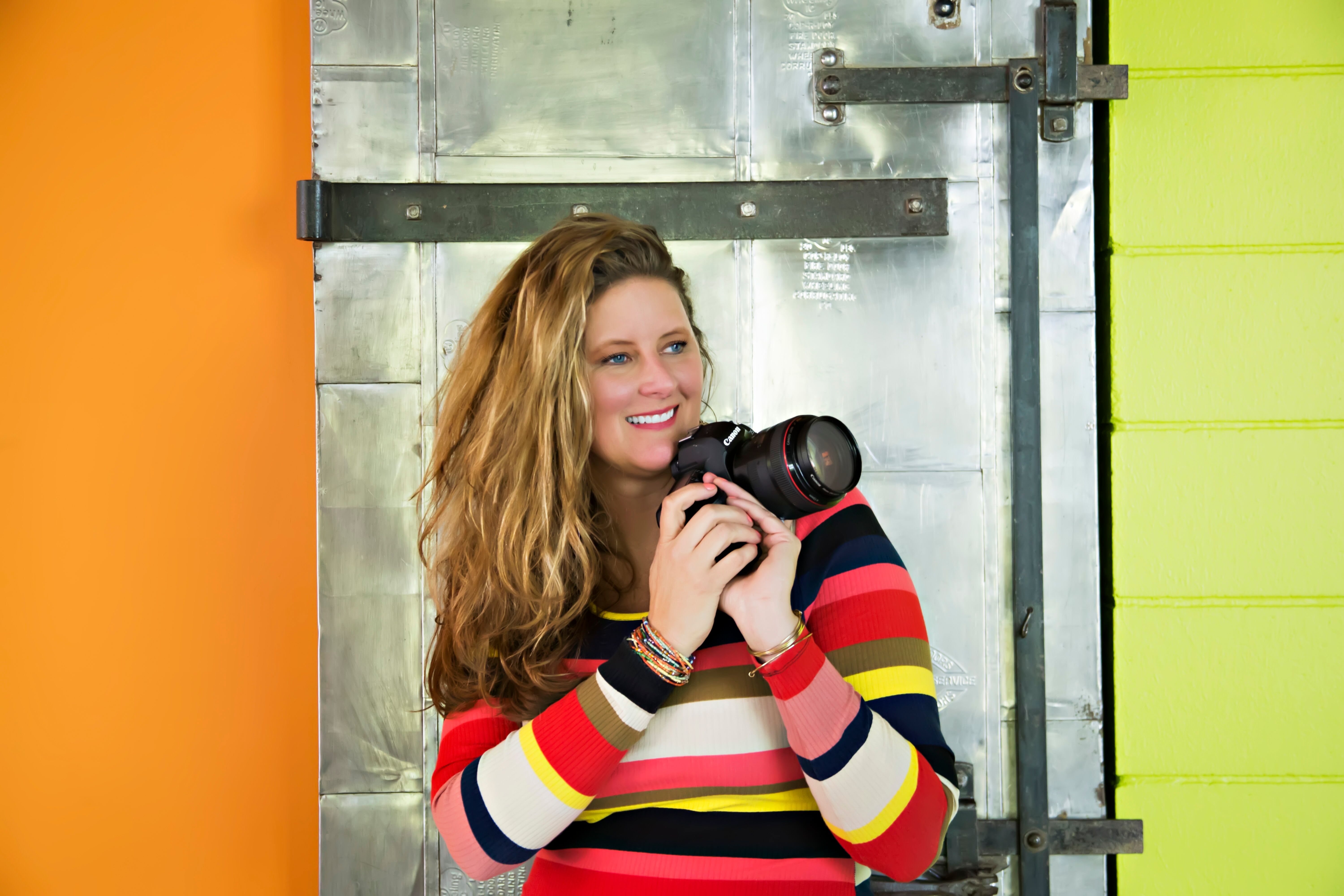 woman with camera sarah petty studio joy of marketing