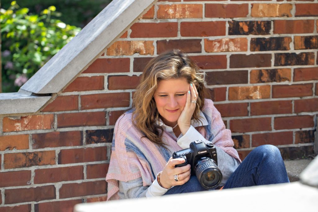 Sarah Petty Photography holding canon camera how to not feel like an imposter in your photography business blog